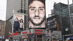 Image: A Nike ad featuring Colin Kaepernick is on display on top of a Model