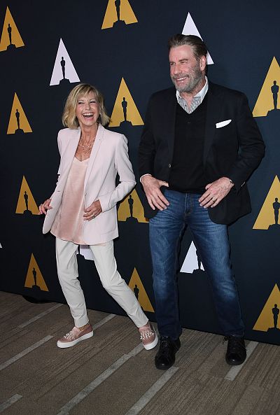 Newton-John reunited with "Grease" co-star John Travolta at last month\'s 40th anniversary celebration of the movie at the Academy of Motion Picture Arts and Sciences (AMPAS) in Beverly Hills.