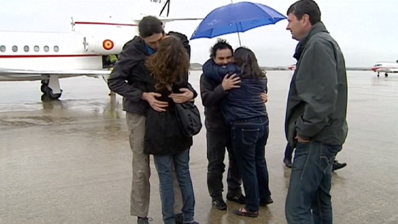 Journalists freed in Syria return home to Spain