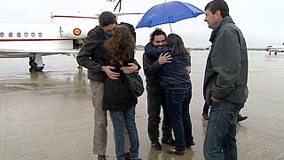 Journalists freed in Syria return home to Spain