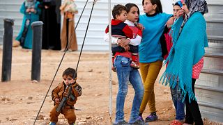 Syrian refugees wait for the arrival of actor Angelina Jolie, UNHCR Special