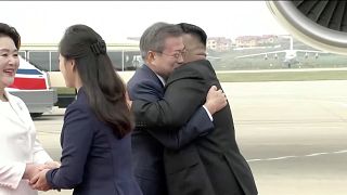 Image: North Korean leader Kim Jong Un and his wife Ri Sol Ju greet South K