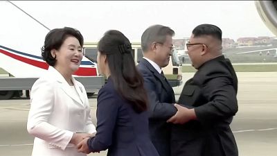 North Korean leader Kim Jong Un and his wife Ri Sol Ju greet South Korean President Moon Jae-in and First Lady Kim Jung-sook at Pyongyang Sunan International Airport, North Korea ahead of the third summit with North Korean leader Kim Jong Un in this still frame taken from video on September 18, 2018.