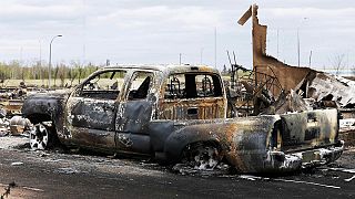 Damage less than feared as Canada wildfire slows down