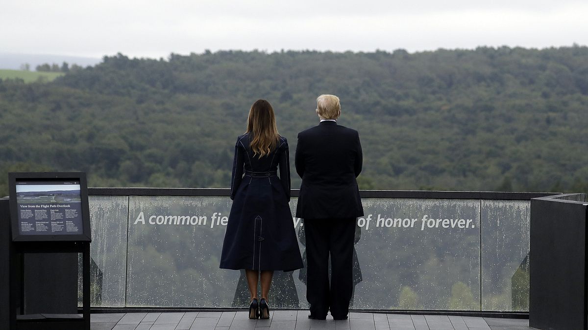 Image: President Donald Trump and first lady Melania Trump, stand along the