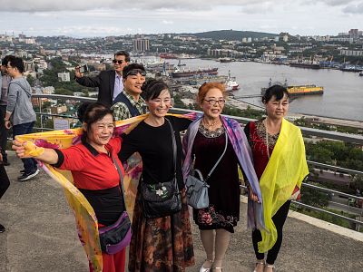 Chinese tourists posing for photos in Vladivostok, Russia, on Sept. 13.