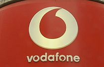 Vodafone's underlying earnings rise, losses through Luxembourg tax hit