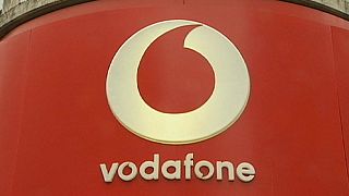 Vodafone's underlying earnings rise, losses through Luxembourg tax hit