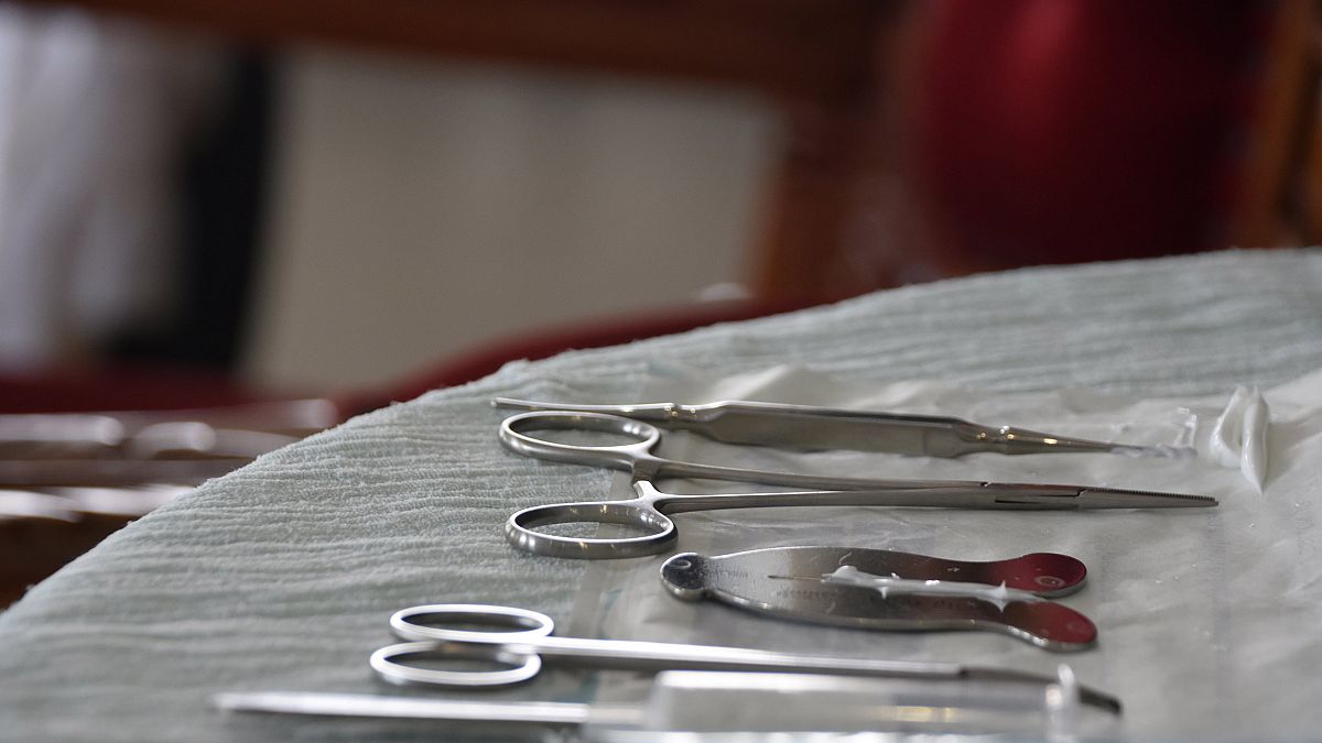 Image: A mohel arranges medical equipment a circumcision ceremony