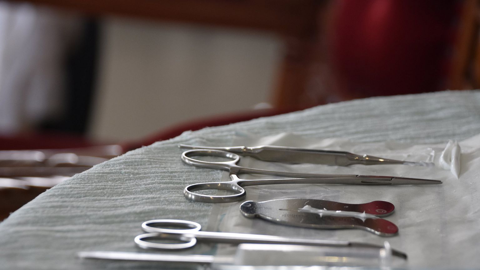 Image: A mohel arranges medical equipment a circumcision ceremony