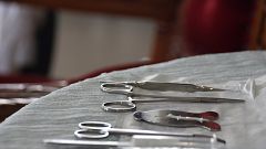 Image: A mohel arranges medical equipment a circumcision ceremony