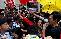 Scuffles in Hong Kong as protesters try to approach Chinese official