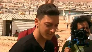 Soccer star Mesut Ozil has kickabout with young Syrian refugees