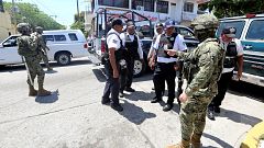 Mexican Marines escort municipal police officers disarmed and detained duri