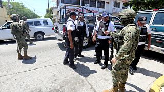 Mexican Marines escort municipal police officers disarmed and detained duri