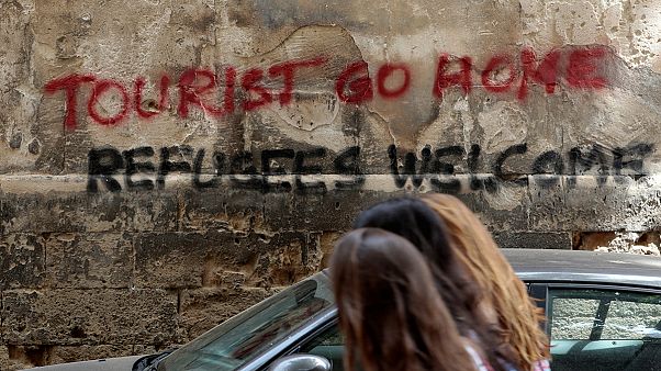 'Tourists go home' say Spanish locals in backlash to holiday boom 'Tourists go home' say Spanish locals in backlash to holiday boom