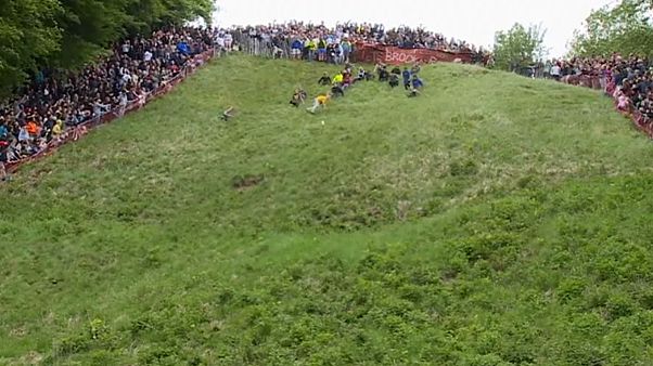 UK daredevils risk life and limb in cheese chase UK daredevils risk life and limb in cheese chase