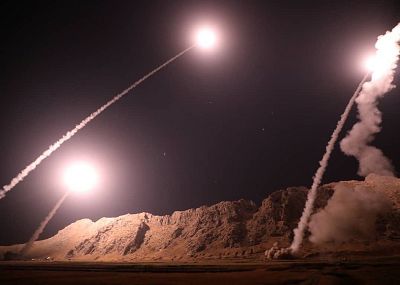 This handout photo provided by Iran\'s Revolutionary Guard purportedly shows missiles being launched into eastern Syria early Monday.
