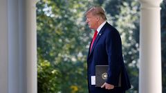Image: President Trump arrives to announce trade deal in the Rose Garden of