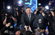 Image: CAQ party leader Legault shakes hands with supporters in Quebec City