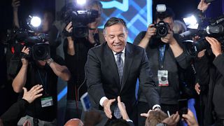 Image: CAQ party leader Legault shakes hands with supporters in Quebec City