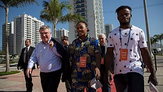 IOC's Bach visits Olympic village with refugee athletes