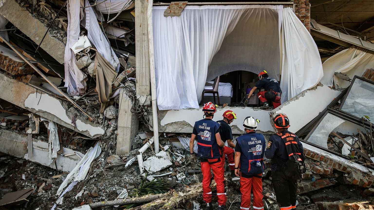 French members of the International Emergency Firefighters prepare to enter