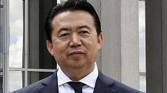 Image: INTERPOL President Meng Hongwei poses during a visit to the headquar