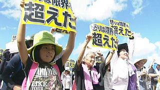 Okinawa rallies against US bases after woman's murder