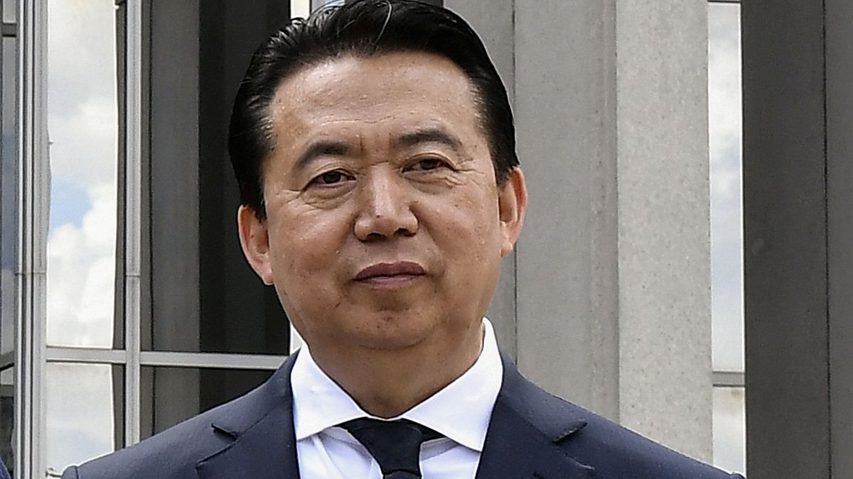 Image: INTERPOL President Meng Hongwei poses during a visit to the headquar