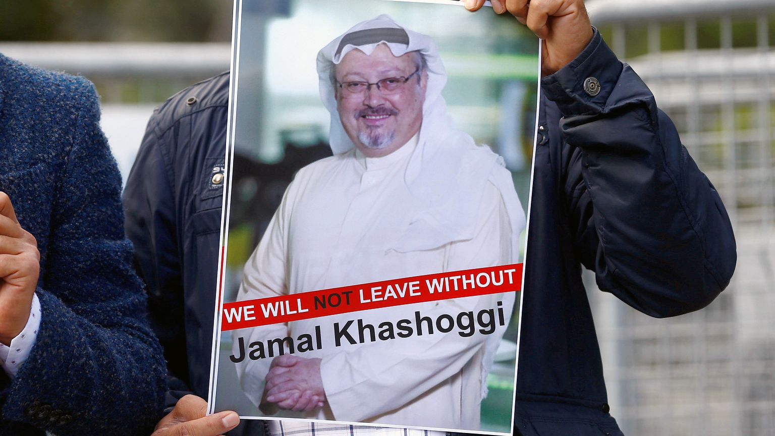Image: A demonstrator holds picture of Saudi journalist Jamal Khashoggi dur
