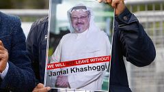 Image: A demonstrator holds picture of Saudi journalist Jamal Khashoggi dur