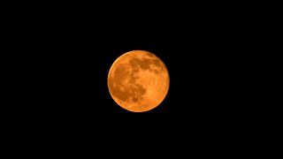 Strawberry moon lights up summer solstice