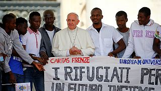 Pope invites refugees to join him on stage