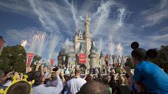 A crowd watches fireworks at Cinderella's castle in Walt Disney World in 20