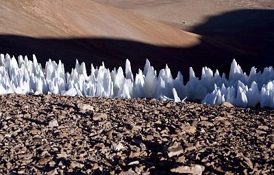 Blade-like ice towers called penitentes occur on Earth in some high, dry and cold tropical regions -- especially the Chilean Andes, as seen here.