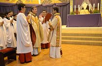 Image: Priest Carlos Urrutigoity celebrates Mass