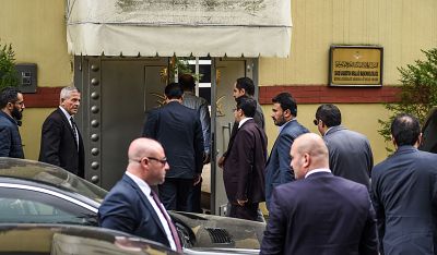 Saudi officials arrive at Saudi Arabia\'s consulate in Istanbul on Tuesday as demonstrators gather to protest the Khashoggi\'s disappearance.
