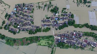 Parts of China and Pakistan submerged as deadly floods hit