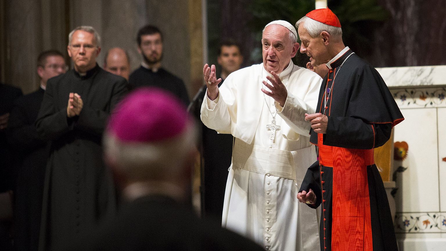 Image: Pope Francis speaks with Cardinal Donald Wuerl during a midday praye