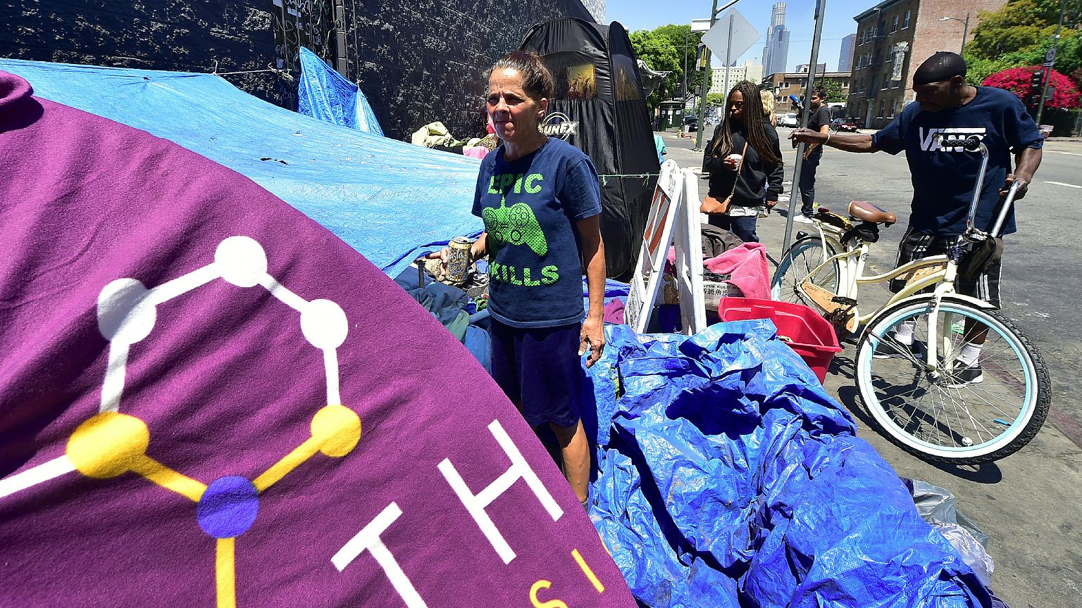 Homeless since August 2016, Tina Marie Van Tasil holds a can of beer while 