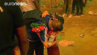 Euro 2016: Distraught French football fan consoled by young Portugal supporter