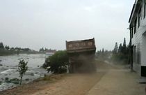 China: trucks driven into flood