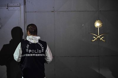 A Turkish forensic police officer carries a box at the Saudi consulate on Wednesday. 