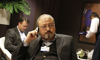 Saudi Arabian journalist Jamal Khashoggi speaks on his cellphone at the World Economic Forum in Davos, Switzerland on Jan. 29, 2011.