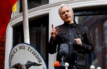 Image:  WikiLeaks founder Julian Assange speaks on the balcony of the Ecuad