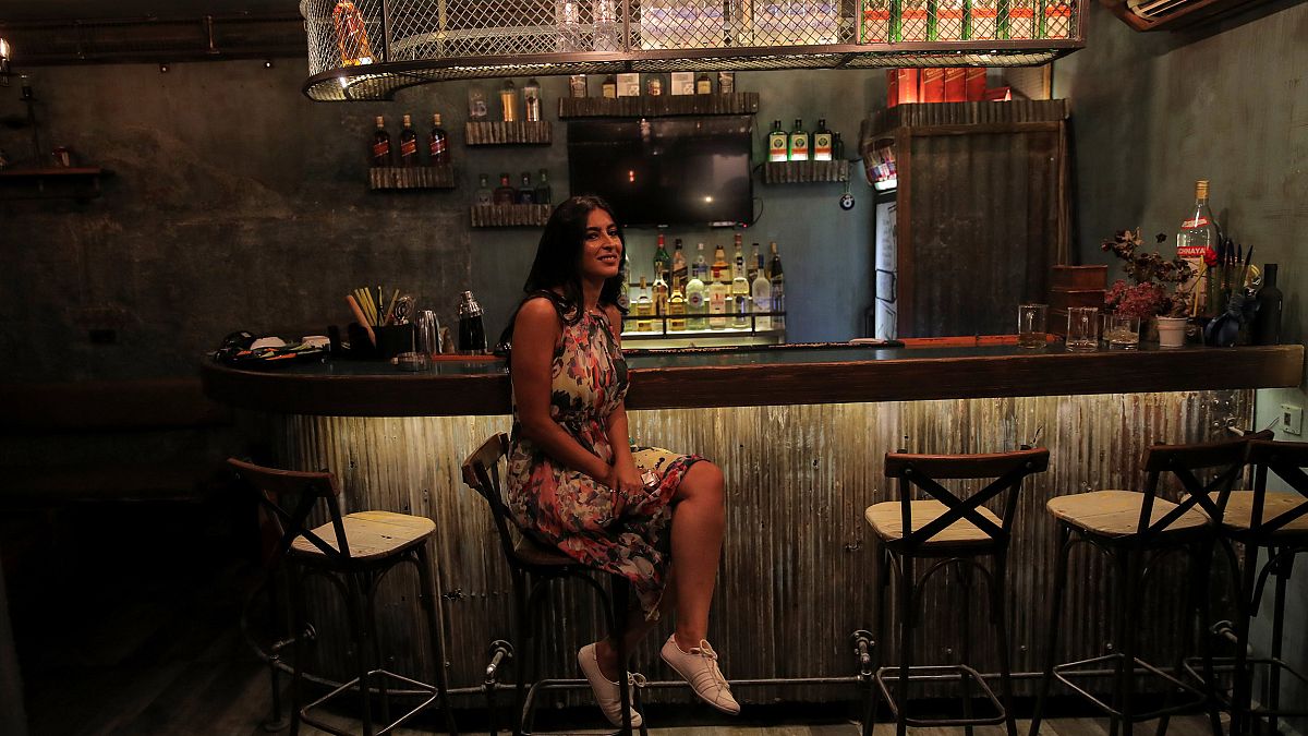 Image: Rasha, 30, the owner of Esco Bar, poses for a photograph in the Old 