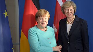 May and Merkel in first face-to-face talks in Berlin