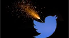 Image: The Twitter logo and stock prices are shown above the floor of the N