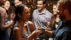 Couples Dancing And Drinking At Evening Party